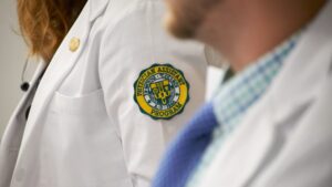 Physician Assistant White Coat with Le Moyne logo