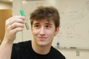 Student in Lab with test tube