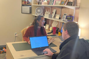 Student meeting with advisor for career advice.