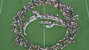 Students forming a Dolphin