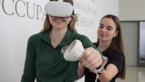 Occupational Therapy students practicing with virtual reality equipment