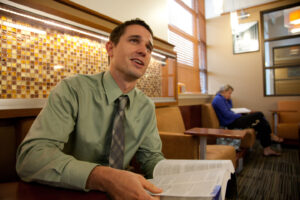 MBA student studying with textbook