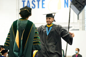 Commencement Photo Student Hugging President Linda LeMura