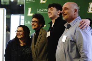 President Linda LeMura with accepted student and family.