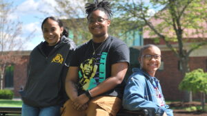 Students on Campus on a sunny day in front of the chapel