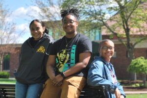 Students on Campus on a sunny day in front of the chapel