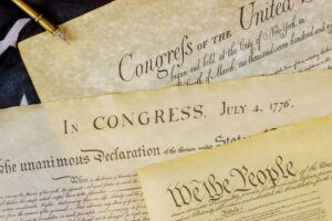 Declaration of Independence U.S. document of American constitution We the people with USA Flag.
