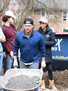 Student volunteering at a Tiny Home for Good
