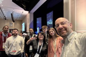 Enwright and students at cybersecurity conference