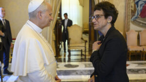 Presiident Linda LeMura and Pope Leo