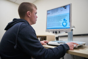Student using adaptive technology